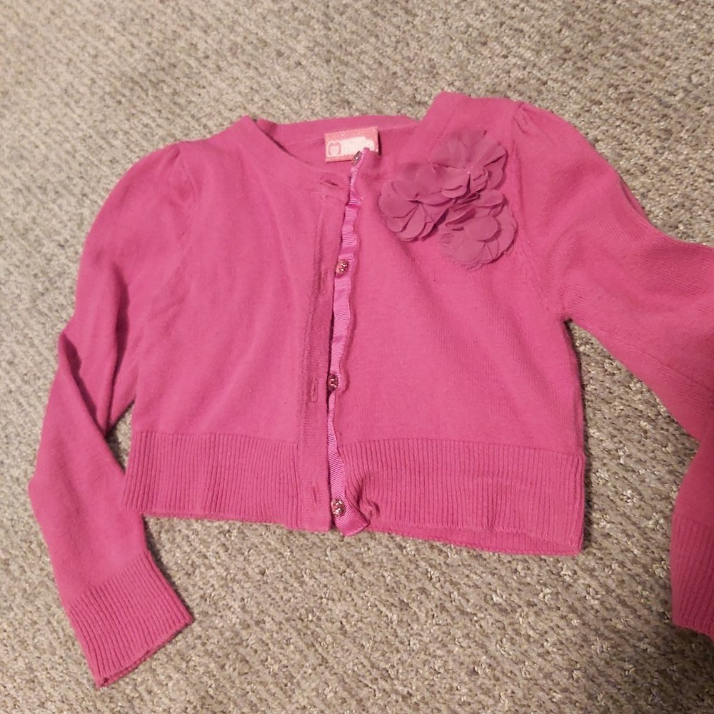 Shrug style cardigan with flower detail and button front